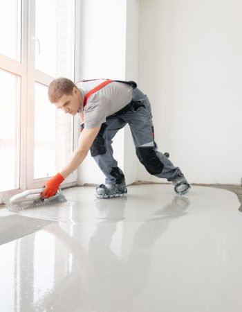 Leveling,With,Mixture,Of,Cement,For,Floors.,Worker,Use,Screed
